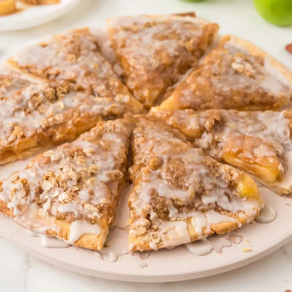 Delicious apple pie pizza topped with cinnamon and apples, a unique dessert treat