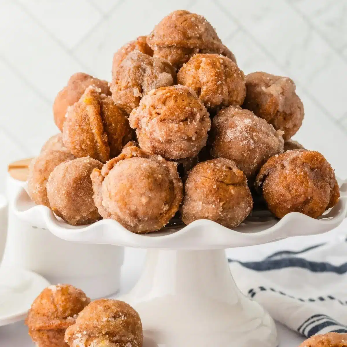 Delicious pumpkin spice donut holes on a rustic wooden table