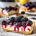 Delicious homemade Blackberry Cheesecake Pie topped with fresh blackberries