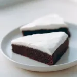 Deliciously moist Ginger Treacle Cake topped with golden syrup.