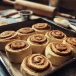 Freshly baked homemade cinnamon rolls on a wooden table