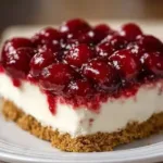 No-bake cherry cheesecake topped with fresh cherries and whipped cream