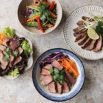 Gluten free thin sliced beef meals with rice bowl stir fry grilled beef and fresh vegetable salad