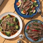 Healthy thin sliced beef recipes served with broccoli, fresh vegetables, and light sauces on plates